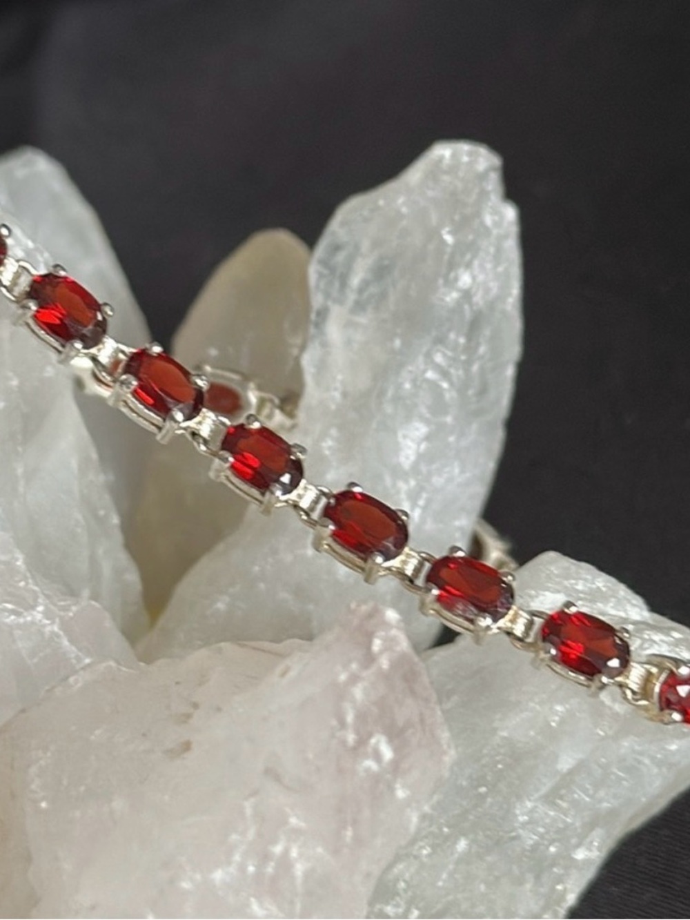 Genuine garnet & sterling EUC tennis bracelet. Appx. 6x4mm stones in 925 silver